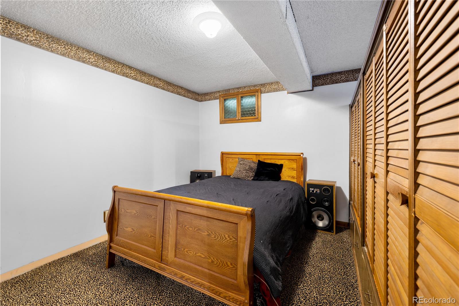 5311 Troy Street Denver, CO 80239 - Photo 40 of 46 a bedroom with a bed and a window