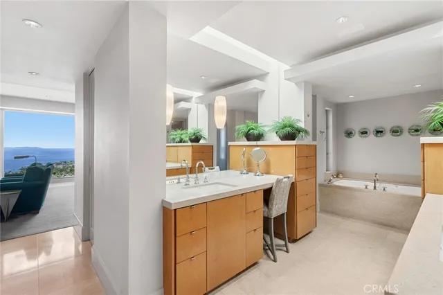 a room with a table chairs and a refrigerator