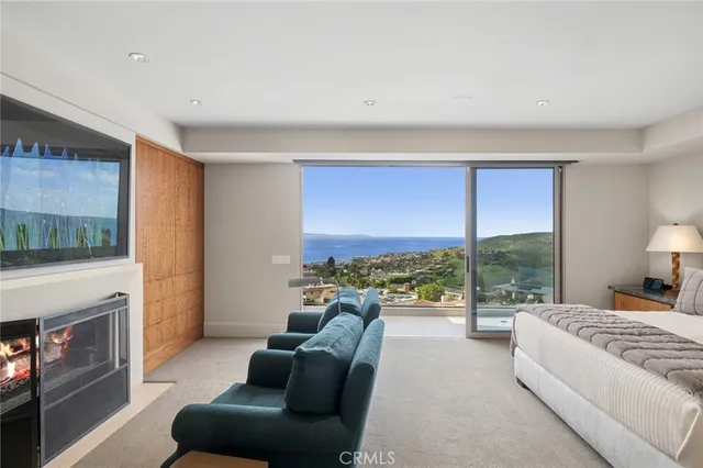 a bedroom with furniture and a fireplace