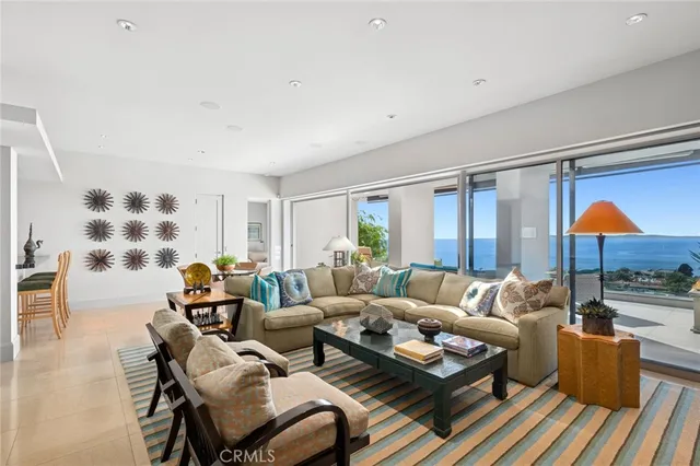 a living room with furniture and a lamp