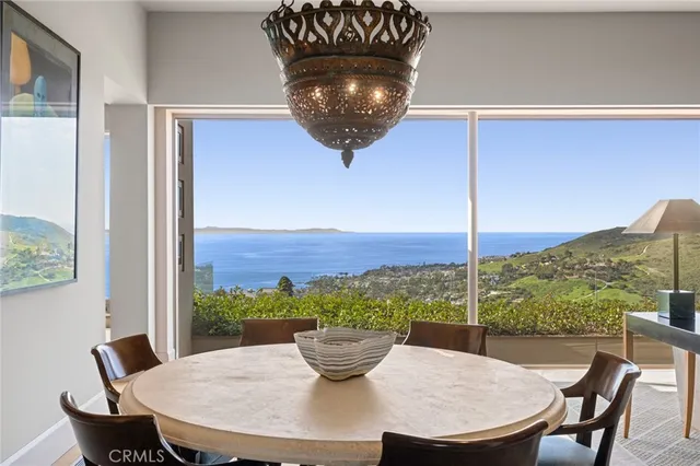 a view of a dining room with furniture window and outside view