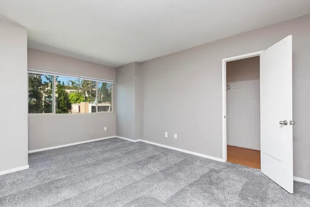 a view of an empty room with a window