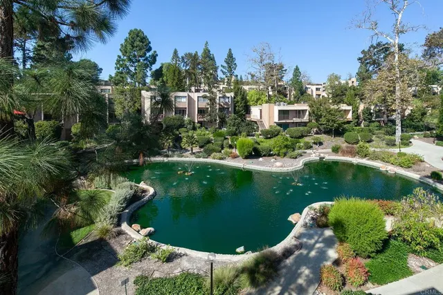 an aerial view of a house with swimming pool outdoor seating and yard