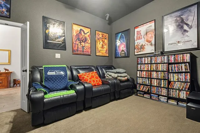 a living room with furniture a rug and a window