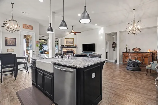 a kitchen with stove and cabinets