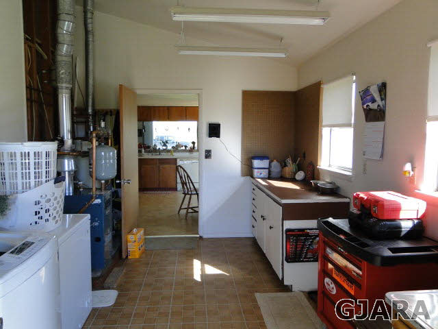 2335 J Road Grand Junction, CO 81505 - Photo 12 of 19 a kitchen with a sink cabinets and appliances