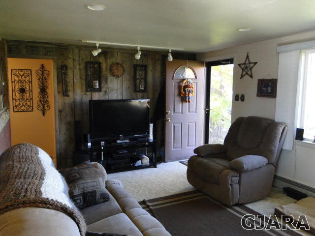 2335 J Road Grand Junction, CO 81505 - Photo 2 of 19 a living room with furniture and a flat screen tv