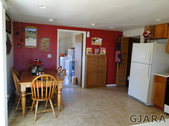 2335 J Road Grand Junction, CO 81505 - Photo 6 of 19 a view of a dining room with furniture