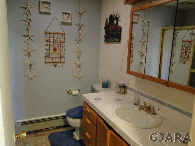 2335 J Road Grand Junction, CO 81505 - Photo 9 of 19 a bathroom with a sink toilet and shower