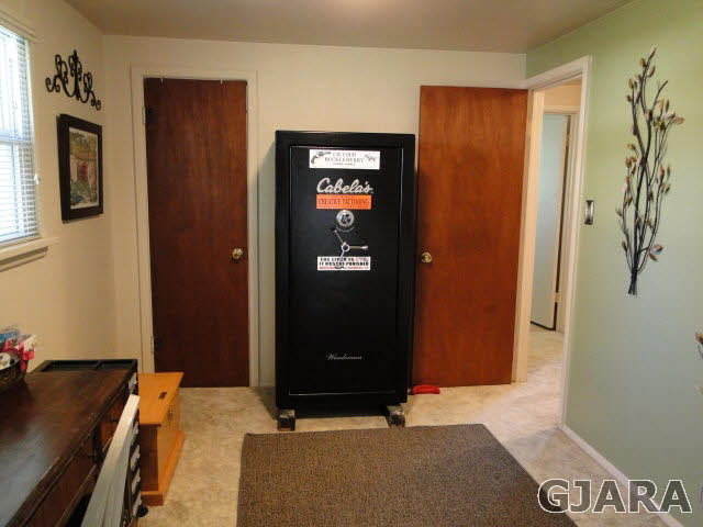 2335 J Road Grand Junction, CO 81505 - Photo 10 of 19 a bedroom with a bed and a desk