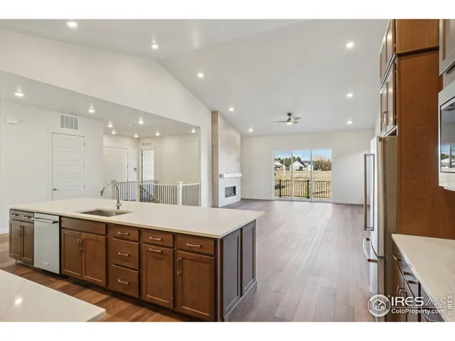 a large bathroom with a sink a large mirror and a shower