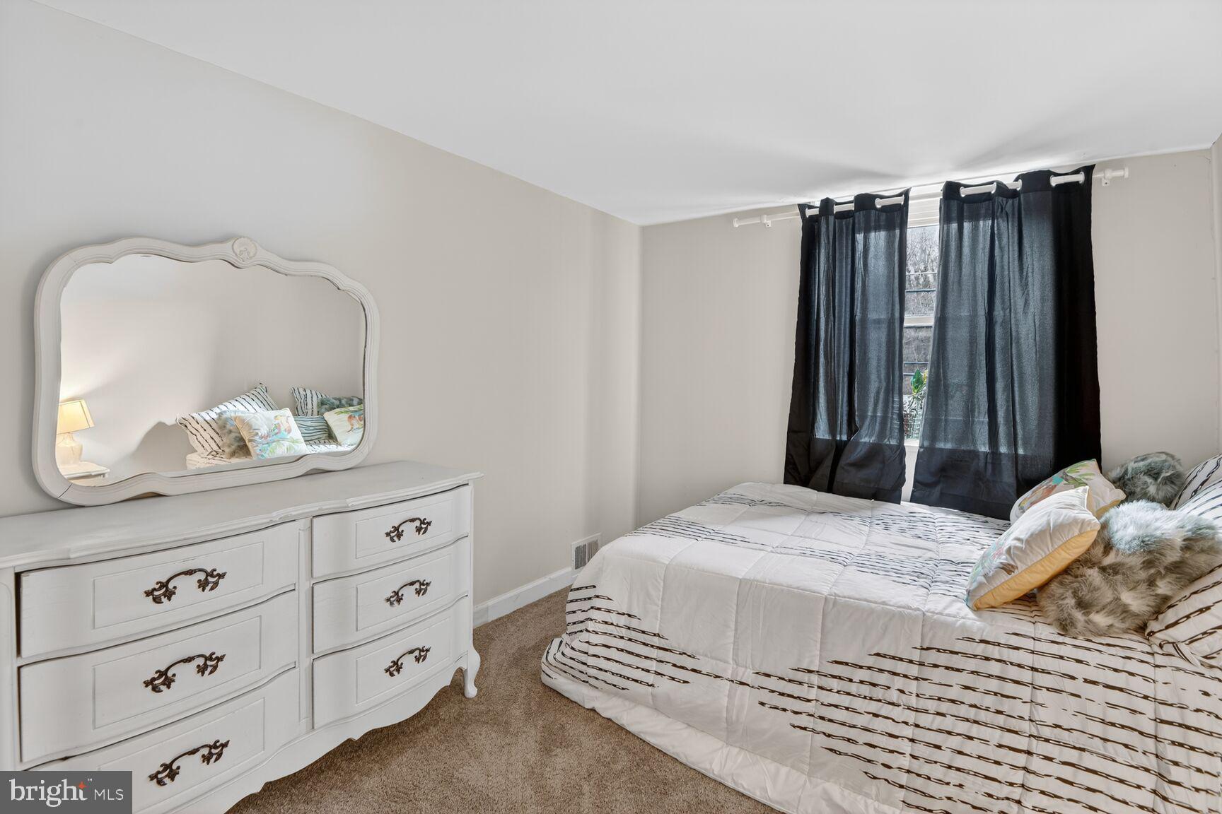 8110 Sheriff Road Landover, MD 20785 - Photo 11 of 15 a bedroom with a bed and a dresser
