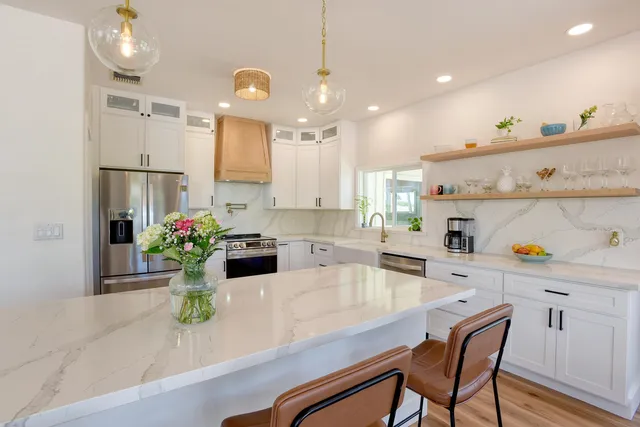 a kitchen with sink and refrigerator