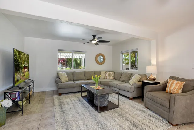 a living room with furniture and a window