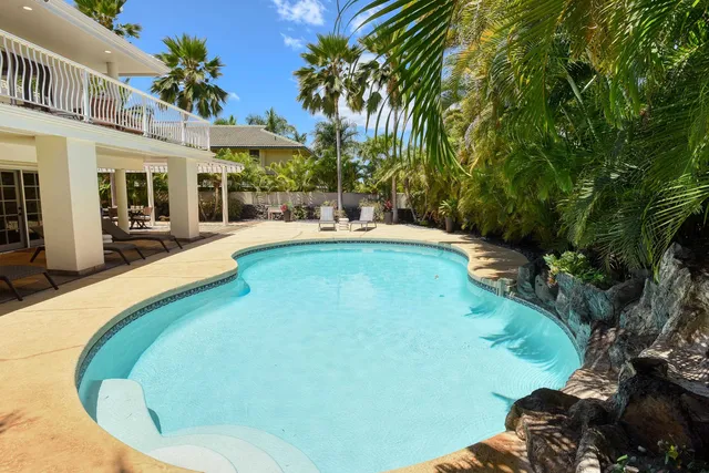 a view of a swimming pool with a patio