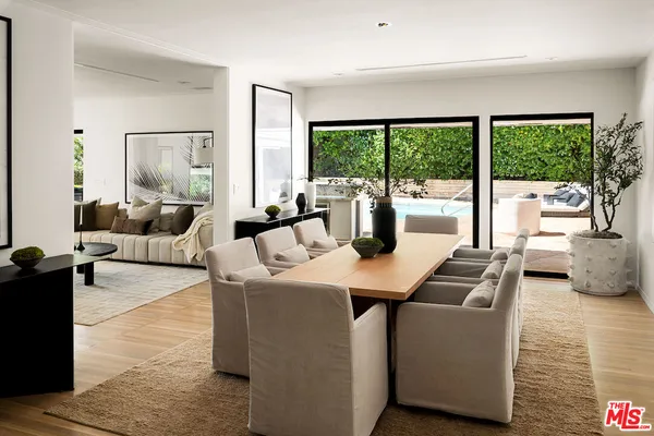 a dining room with table and chairs