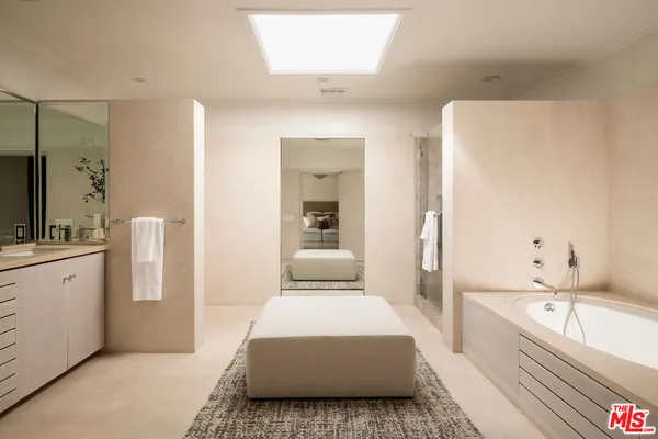 a bathroom with a sink and mirror