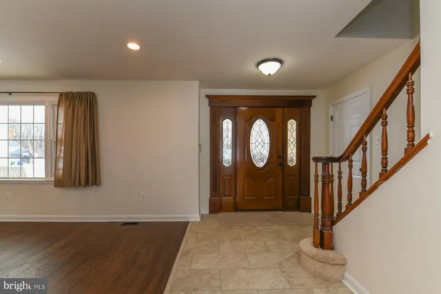 a view of an entryway door with wooden floor