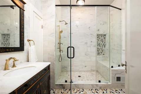 a bathroom with a shower and a sink