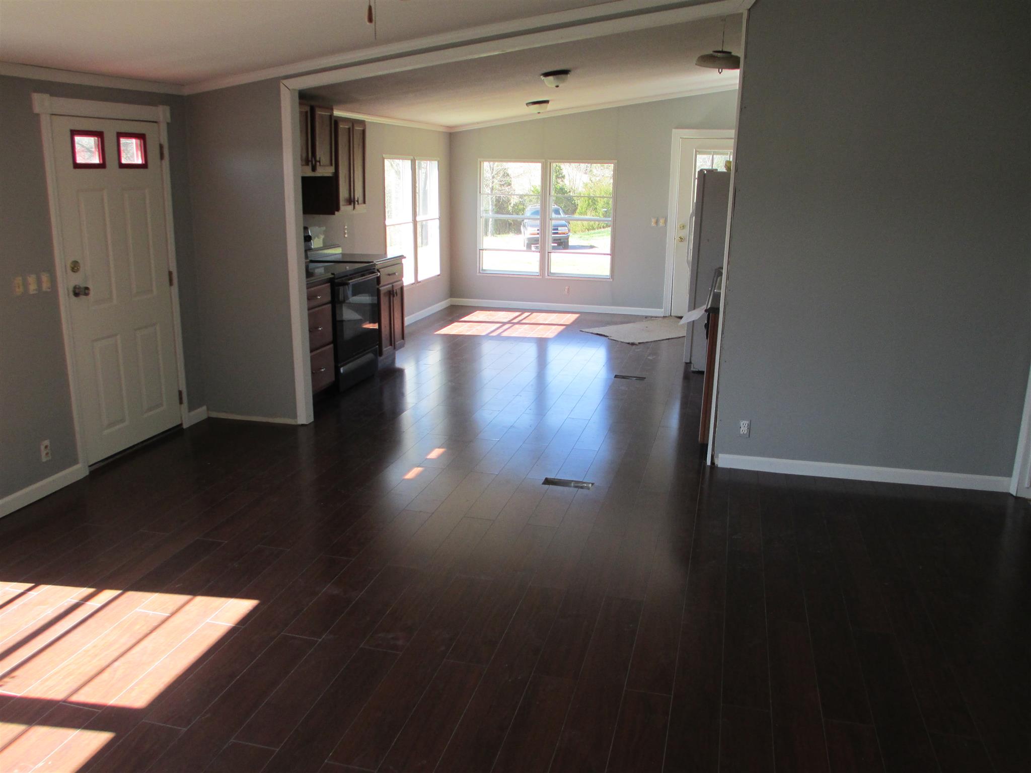 2849 Beasleys Bend Road Lebanon, TN 37087 - Photo 7 of 18 a view of a hallway with wooden floor and a living room