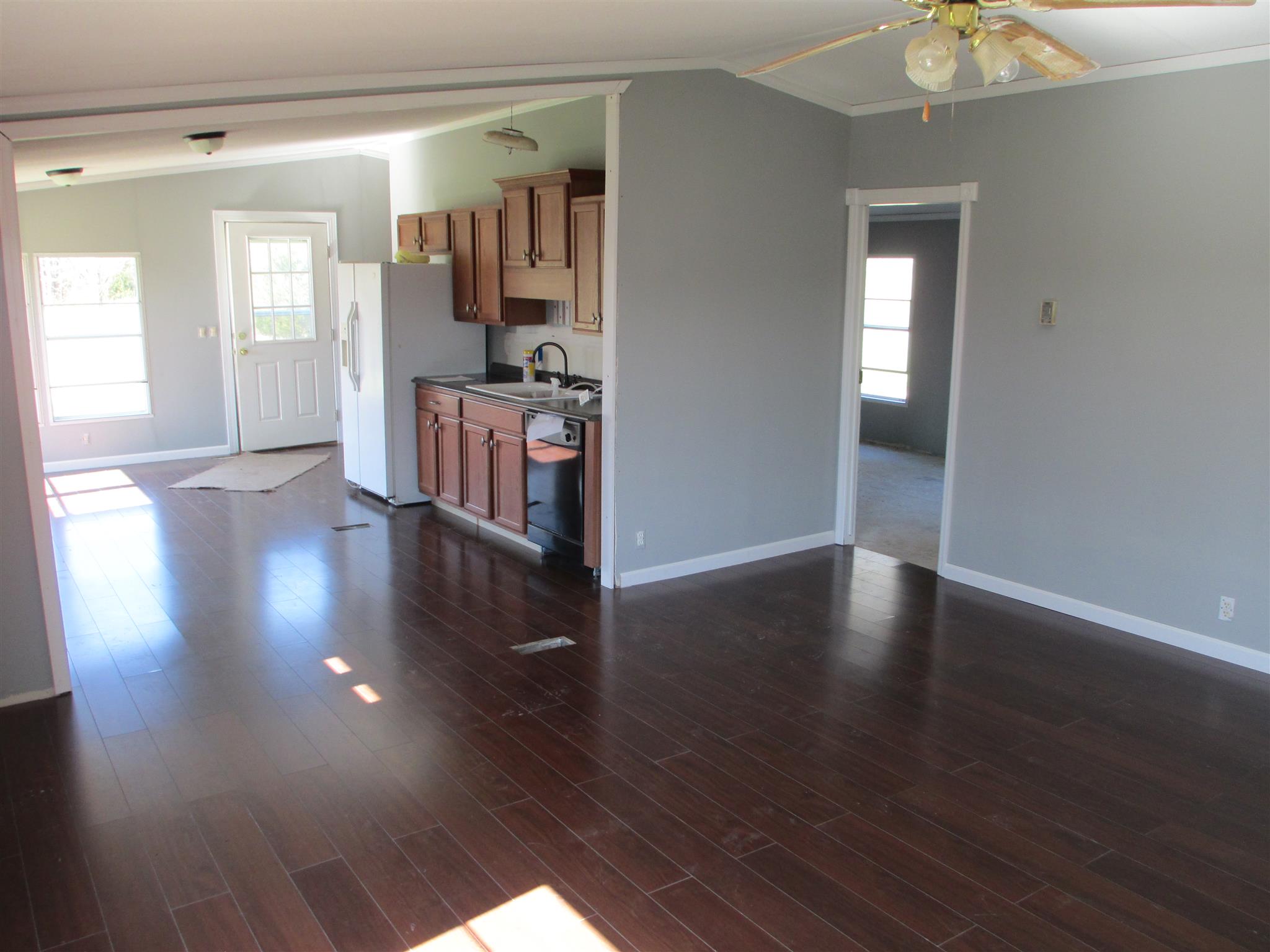2849 Beasleys Bend Road Lebanon, TN 37087 - Photo 8 of 18 a view of a hallway with wooden floor and a chandelier