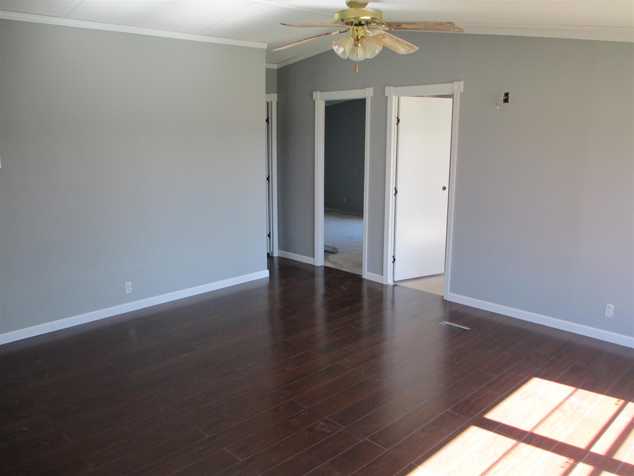 2849 Beasleys Bend Road Lebanon, TN 37087 - Photo 9 of 18 a view of an empty room with wooden floor and a window