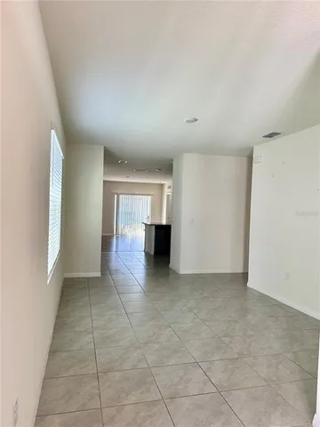 wooden floor in an empty room and a window