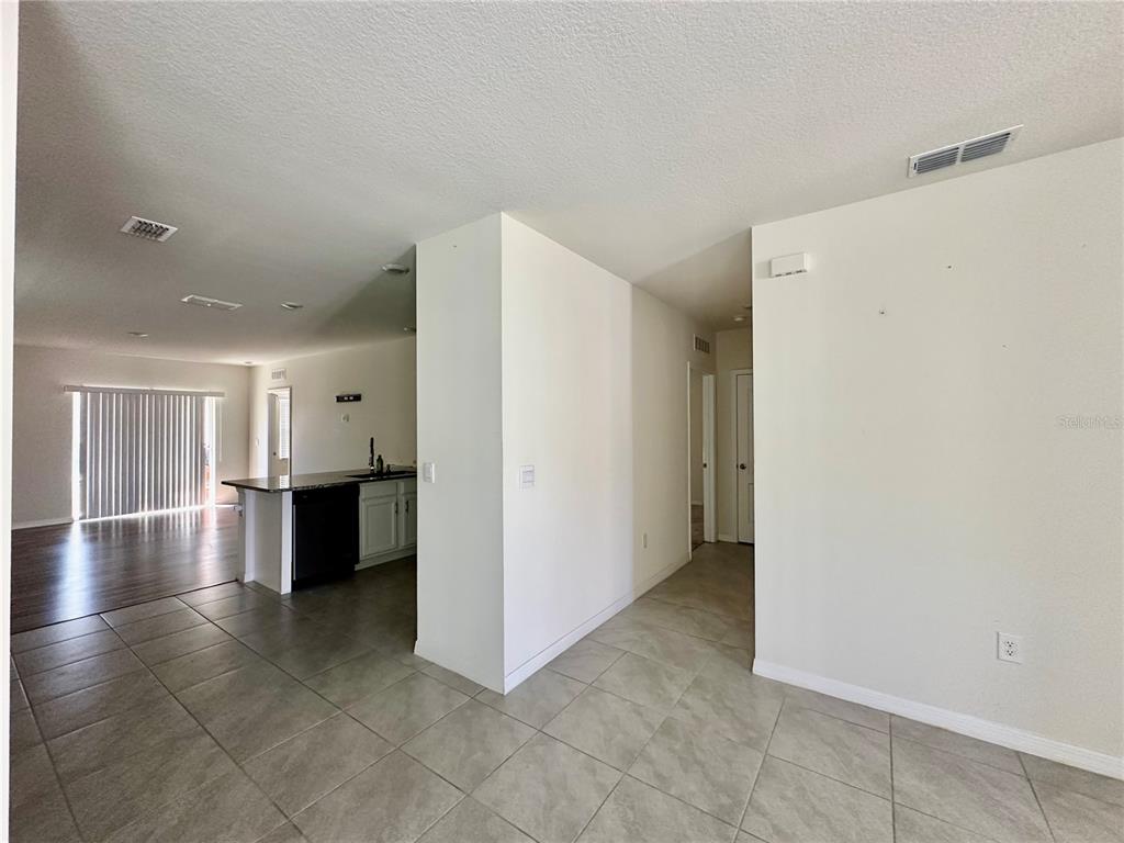 2657 Harmonia Hammock Road Harmony, FL 34773 - Photo 3 of 5 a view of a kitchen with a sink and refrigerator