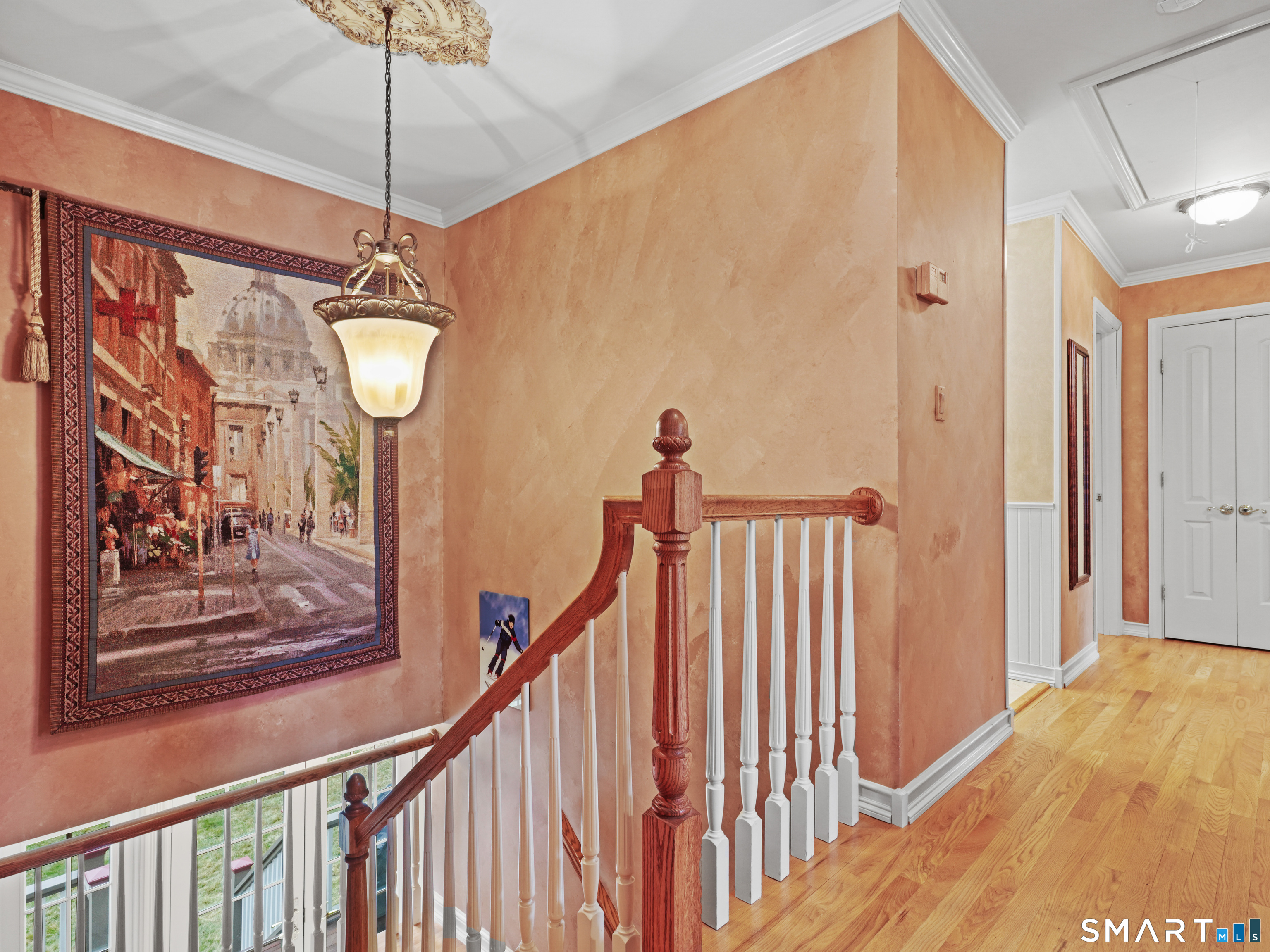 82 Ramapoo Road Ridgefield, CT 06877 - Photo 22 of 40 a view of a hallway with a window and chandelier