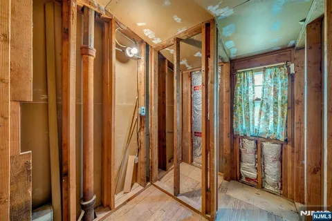 a view of a elevator with wooden floor