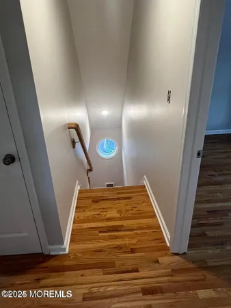a view of a hallway with staircase