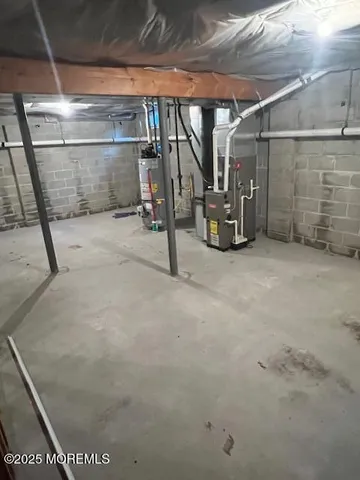 a view of empty room with wooden ceiling