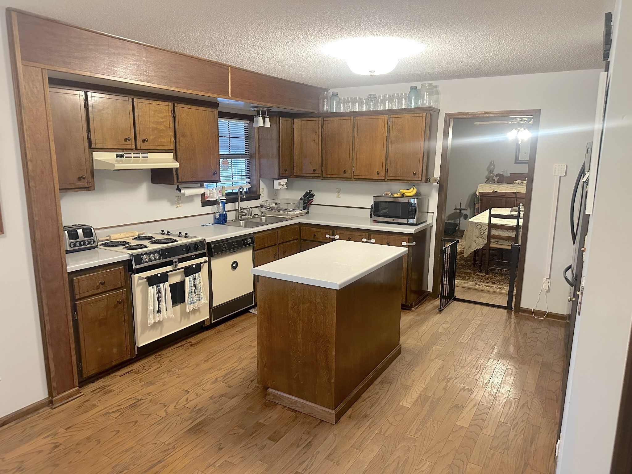 2987 Rock Road Morrison, TN 37357 - Photo 12 of 46 a kitchen with stainless steel appliances granite countertop a stove top oven and sink