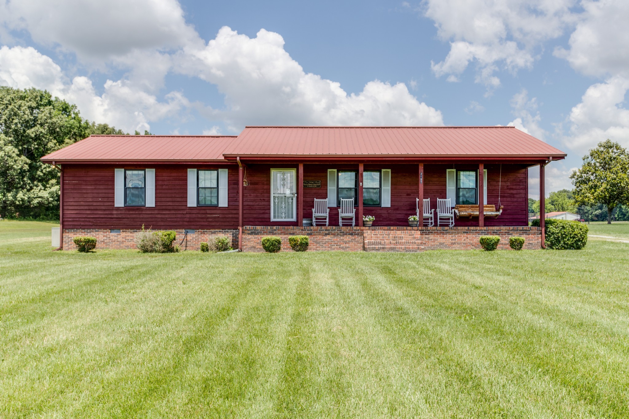 2987 Rock Road Morrison, TN 37357 - Photo 2 of 46 a front view of a house with swimming pool and porch