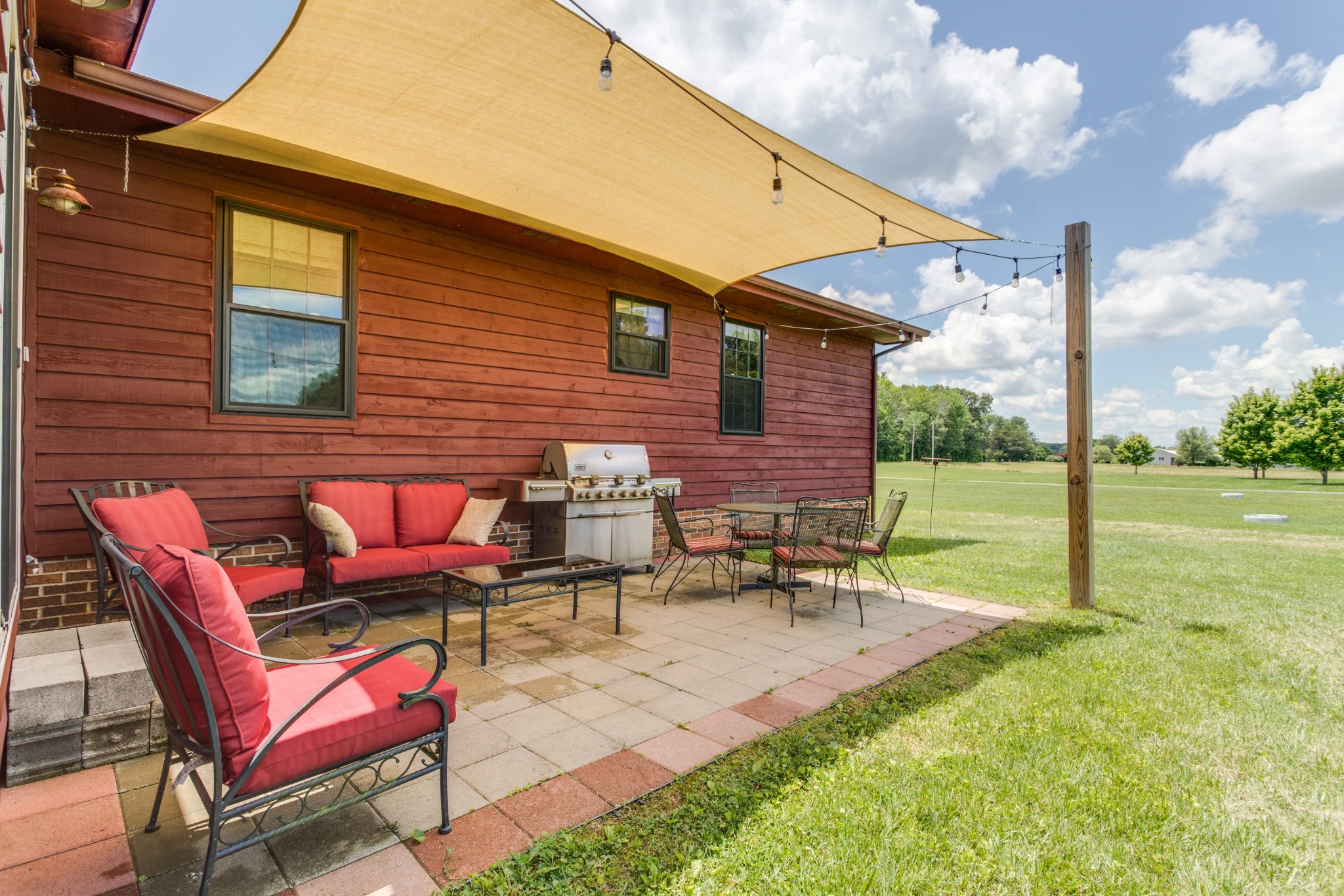 2987 Rock Road Morrison, TN 37357 - Photo 7 of 46 a backyard of a house with outdoor seating