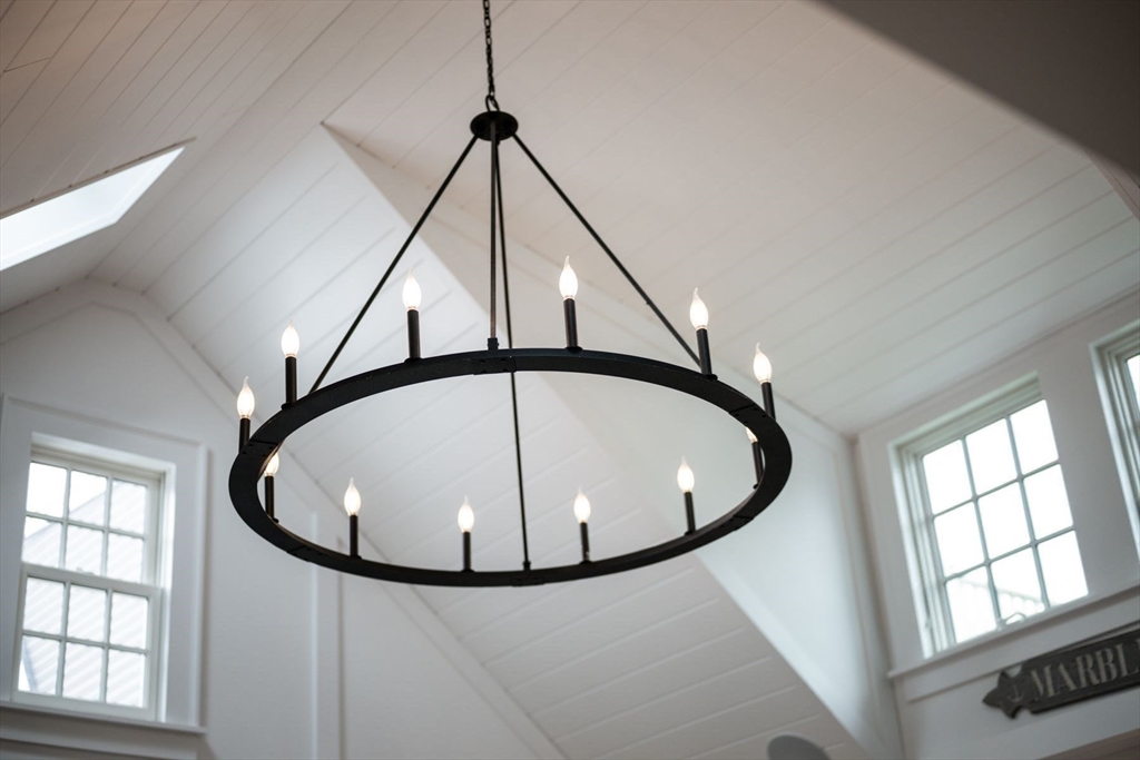 31 Franklin Street Marblehead, MA 01945 - Photo 13 of 35 a view of a hallway with chandelier and entryway