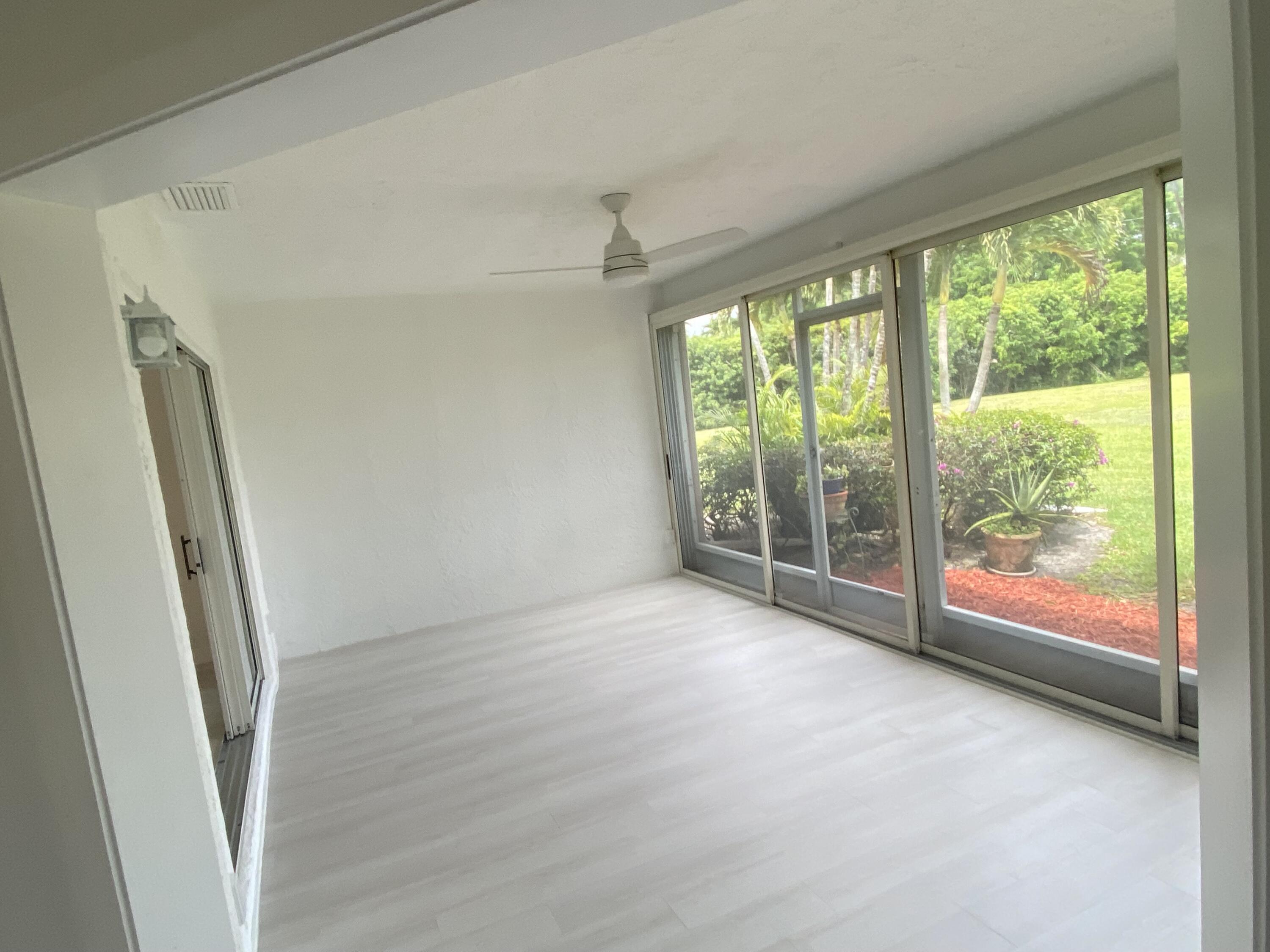 7591 Red Ruby Drive Delray Beach, FL 33446 - Photo 13 of 29 an empty room with windows