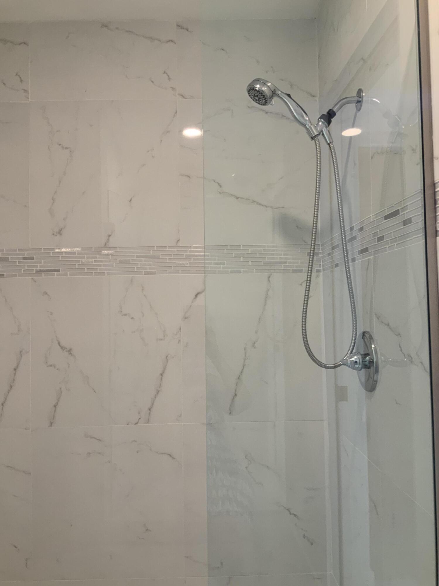 7591 Red Ruby Drive Delray Beach, FL 33446 - Photo 22 of 29 a bathroom with a shower