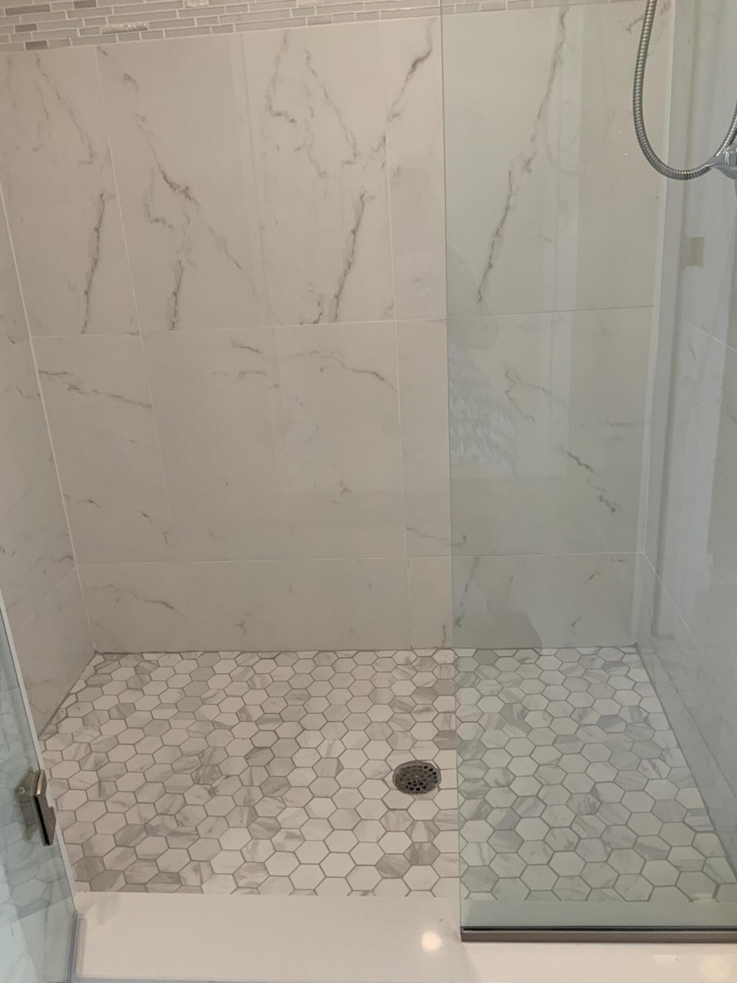 7591 Red Ruby Drive Delray Beach, FL 33446 - Photo 23 of 29 a bathroom with a shower