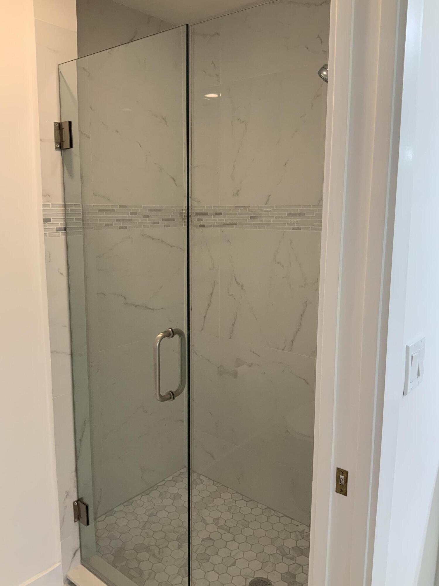 7591 Red Ruby Drive Delray Beach, FL 33446 - Photo 24 of 29 a bathroom with a shower