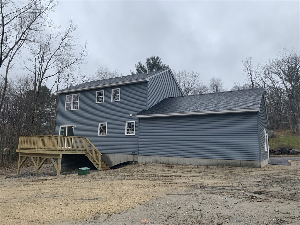 244 Holtshire Road, Unit LOT 4 Orange, MA 01364 - Photo 15 of 17 a front view of a house with a yard