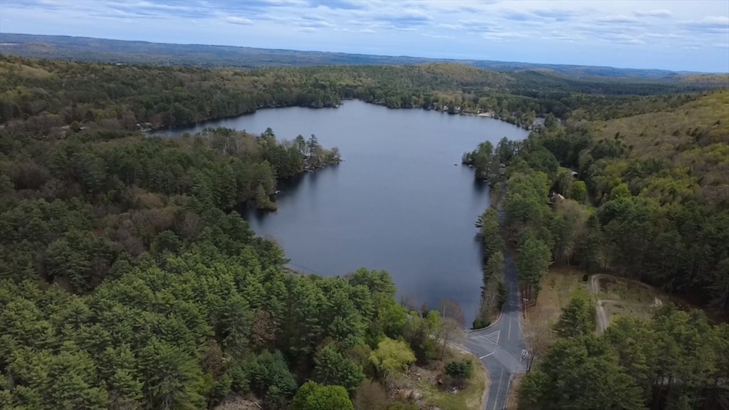 244 Holtshire Road, Unit LOT 4 Orange, MA 01364 - Photo 17 of 17 an aerial view of green landscape with trees houses and lake view
