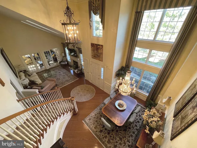 a view of living room with furniture and a chandelier