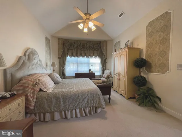 a bed room with a bed and window