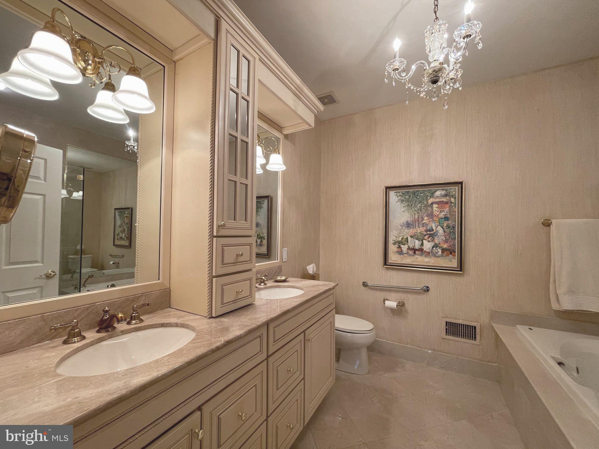 293 Sydney Road Southampton, PA 18966 - Photo 20 of 37 a spacious bathroom with a granite countertop sink a toilet a mirror a vanity and a shower