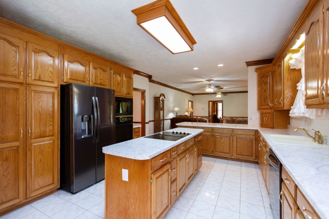 1930 Alsup Mill Road Lascassas, TN 37085 - Photo 15 of 50 a kitchen with stainless steel appliances granite countertop a refrigerator a sink and a stove