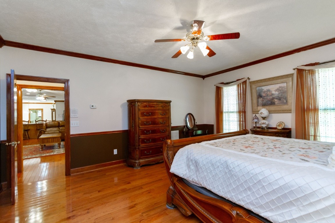 1930 Alsup Mill Road Lascassas, TN 37085 - Photo 18 of 50 a bedroom with a bed and wooden floor