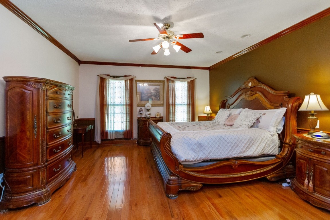 1930 Alsup Mill Road Lascassas, TN 37085 - Photo 19 of 50 a bedroom with a bed and wooden floor