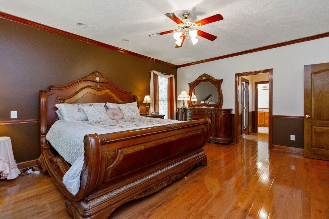 1930 Alsup Mill Road Lascassas, TN 37085 - Photo 20 of 50 a bedroom with a bed and wooden floor