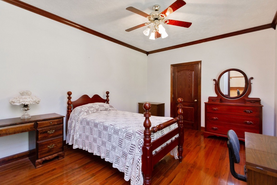 1930 Alsup Mill Road Lascassas, TN 37085 - Photo 21 of 50 a bed room with a bed and a chandelier